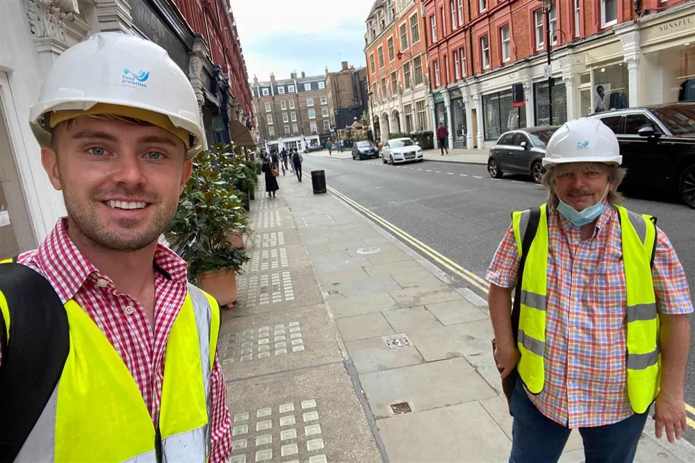 Simon Crowther with civil engineer John Mattinson surveying properties in Central London