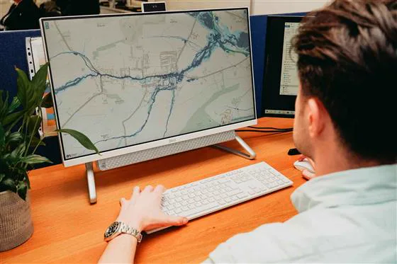 Simon Crowther reviewing flood mapping on screen