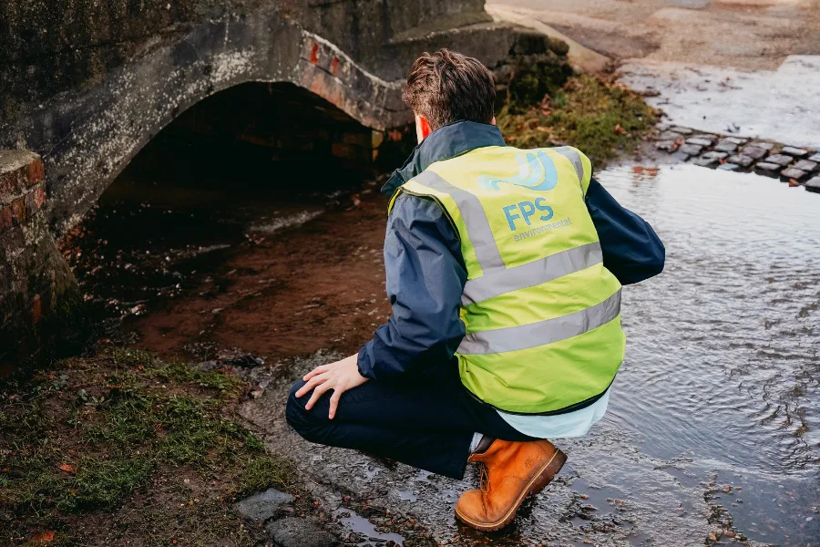 Simon Crowther inspecting a culvert during a flood risk investigation
