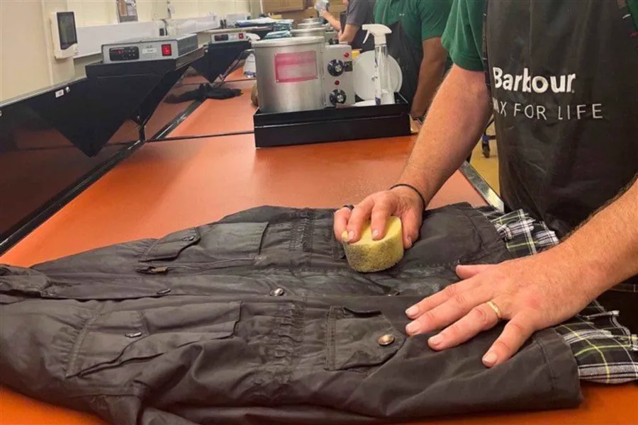 Simon Crowther re-waxing a Barbour jacket during a collaboration with Barbour